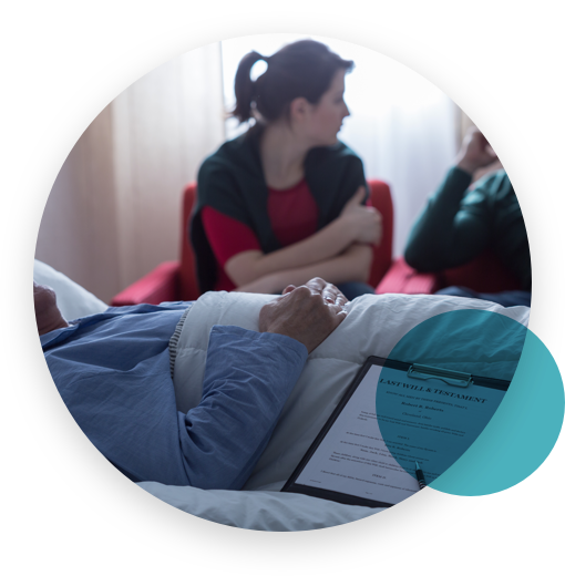 Man and woman discussing in front of a patient with a will in a hospital room