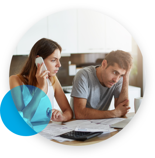 Stressed couple dealing with several documents