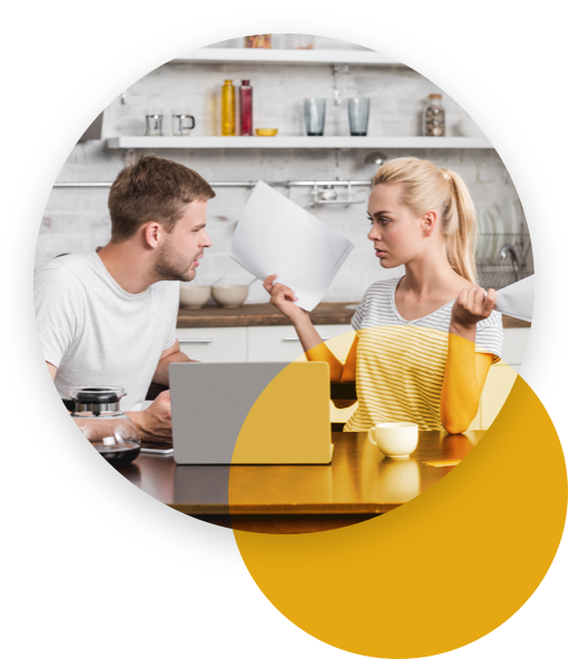 Man looking angrily at a woman holding over a paper