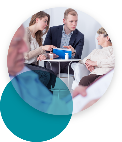 Young couple discussing with a senior woman and a man reading a paper