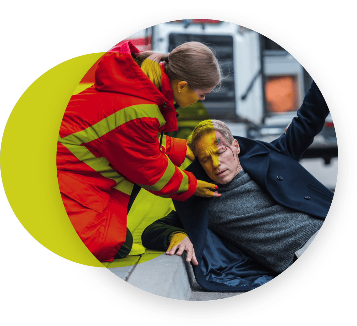 Injured man being assisted by a volunteer
