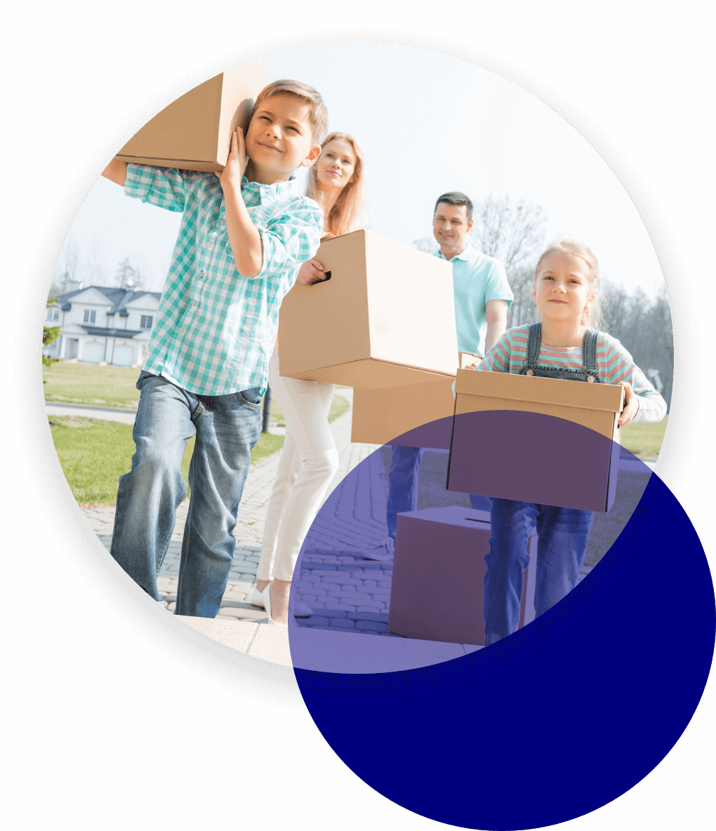 Family carrying moving-in boxes