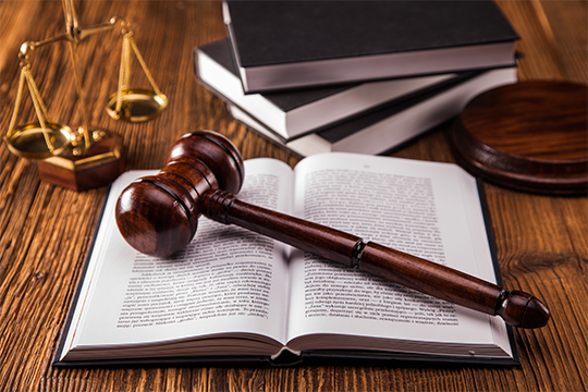 Mallet, legal books and scales of justice
